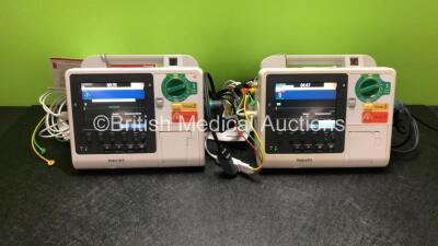 2 x Philips Heartstart XL+ Defibrillators Including ECG and Printer Options *Mfd 2013 / 2013* with 2 x Paddle Leads and 2 x Philips ECG Leads (Both Power Up)