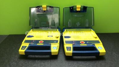 2 x Cardiac Science Powerheart AED G3 Defibrillators with 2 x Powerheart AED G3 Batteries (Both Power Up)