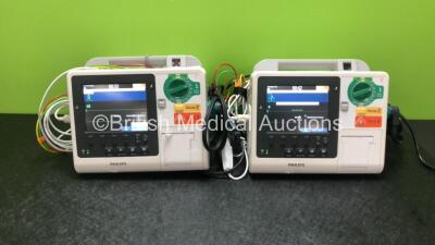 2 x Philips Heartstart XL+ Defibrillators Including ECG and Printer Options *Mfd 2013 / 2013* with 2 x Paddle Leads and 2 x Philips ECG Leads (Both Power Up)