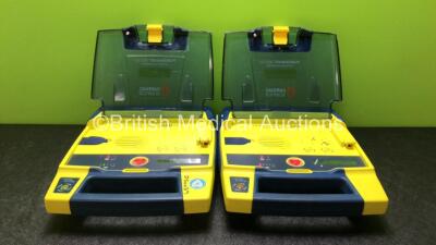 2 x Cardiac Science Powerheart AED G3 Defibrillators with 2 x Powerheart AED G3 Batteries (Both Power Up)