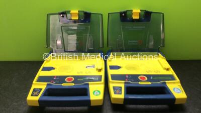 2 x Cardiac Science Powerheart AED G3 Defibrillators with 2 x Powerheart AED G3 Batteries (Both Power Up)