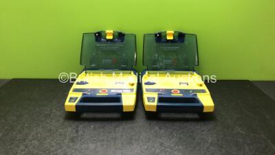 2 x Cardiac Science Powerheart AED G3 Defibrillators with 2 x Powerheart AED G3 Batteries (Both Power Up)