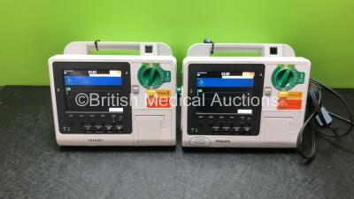 2 x Philips Heartstart XL+ Defibrillators Including ECG and Printer Options and 1 x Paddle Lead (Both Power Up) *SN US71514209 / US61717191*