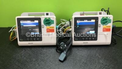 2 x Philips Heartstart XL+ Defibrillators Including ECG and Printer Options *Mfd 2014 / 2013* with 2 x Paddle Leads and 2 x Philips ECG Leads (Both Power Up)