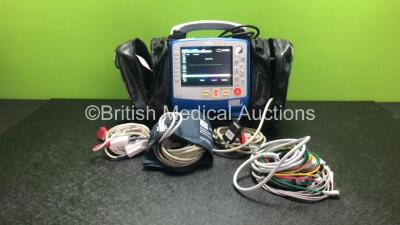 Zoll X Series Monitor/Defibrillator Including ECG, SPO2, NIBP, CO2 and Printer Options with 1 x Sure Power II Battery, 1 x NIBP Cuff and Hose, 1 x 4 Lead ECG Lead, 1 x 6 Lead ECG Lead, 1 x Paddle Lead and 1 x SPO2 Finger Sensor in Carry Bag (Powers Up and