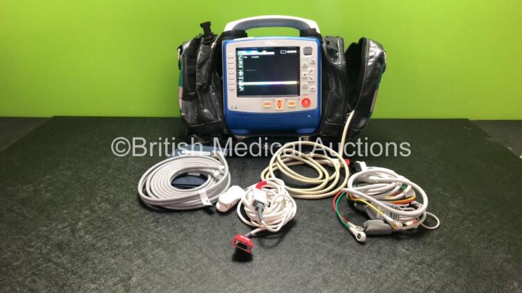 Zoll X Series Monitor/Defibrillator Including ECG, SPO2, NIBP, CO2 and Printer Options with 1 x Sure Power II Battery, 1 x NIBP Cuff and Hose, 1 x 4 Lead ECG Lead, 1 x 6 Lead ECG Lead, 1 x Paddle Lead and 1 x SPO2 Finger Sensor in Carry Bag (Powers Up and