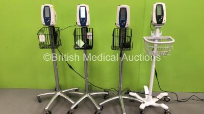 4 x Welch Allyn Spot Vital Signs Monitors on Stands with 3 x AC Power Supplies (All Power Up)