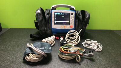 Zoll X Series Monitor/Defibrillator Including ECG, SPO2, NIBP, CO2 and Printer Options with 1 x Sure Power II Battery, 1 x NIBP Cuff and Hose, 1 x 4 Lead ECG Lead, 1 x 6 Lead ECG Lead, 1 x Paddle Lead and 1 x SPO2 Finger Sensor in Carry Bag (Powers Up and