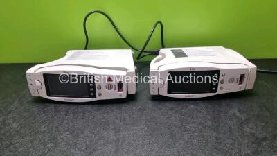 2 x Masimo Radical 7 Pulse Oximeters with Docking Stations (Both no Power with Damage to Casing)