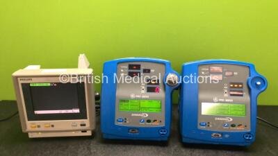 Job Lot Including 2 x GE Dinamap Pro 300V2 Vital Signs Monitors (Both Power Up with Damage to Casing, 1 x Missing Dial - See Photos) and 1 x Philips M3 M3046A Patient Monitor (Powers Up, Damaged Handle and Casing - See Photos)