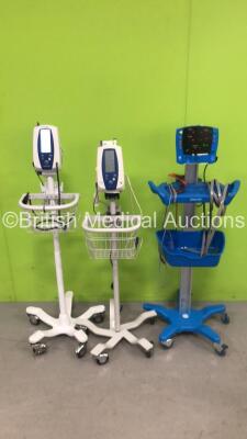 Job Lot of Patient Monitor on Stands Including 1 x GE V100 Dinamap Patient Monitor on Stand with 1 x AC Power Supply, 1 x SpO2 Finger Sensor and 1 x NIBP Hose, 2 x Welch Allyn Spot Vital Signs Monitor On Stand with 2 x AC Power Supplies and 1 x NIBP Hose,