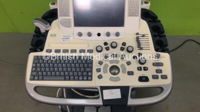 GE Logiq E9 Flat Screen Ultrasound Scanner *Mfd 09-2011* with 1 x Ultrasound Transducer / Probe (C1-5-D Ref.5261135 *Mfd 10-2008) (Powers Up with HDD Removed and 1 x Missing Dial) *107285US9* - 3