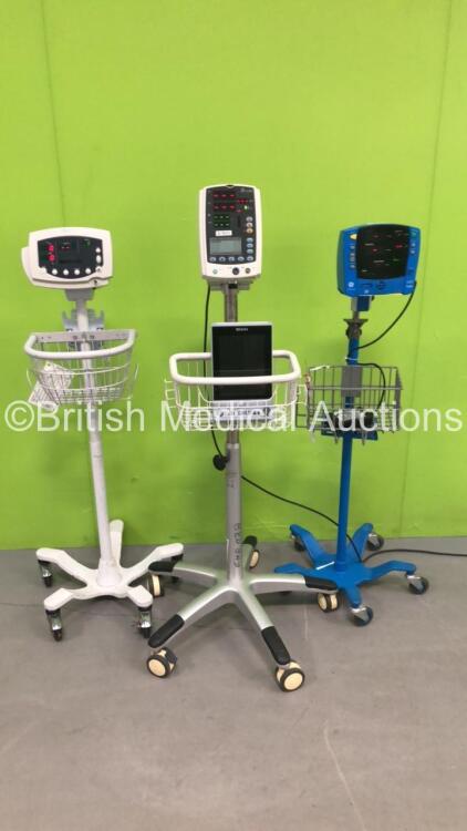 Job Lot Including 1 x Welch Allyn 53N00 Patient Monitor on Stand (Powers Up) 1 x Mindray VS-800 Patient Monitor on Stand (Powers Up with Damaged Light-See Photo) 1 x GE V100 Dinamap Patient Monitor on Stand (Powers Up) and 1 x Edan iN3 Monitor (Powers Up)