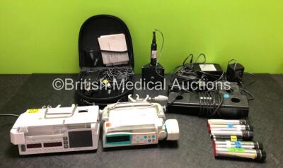 Mixed Lot Including 1 x Arcomed AG Syramed uSP 6000 Syringe Pump (Powers Up with Damage to Casing - See Photos) 1 x B Braun Perfusor Space Syringe Pump (Untested Due to No Power Supply) and Various Otoscope / Ophthalmoscope Handles and Base Units *SN 6984