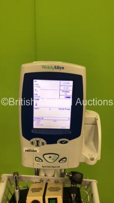 1 x Welch Allyn Spot Vital Signs LXi Monitor on Stand and 1 x Welch Allyn 74716 Transformer with 1 x Attachment (Both Power Up) - 2