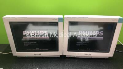 2 x Philips IntelliVue MP70 Touch Screen Patient Monitors (Both Power Up) with 2 x Philips M8048A Module Racks - 4