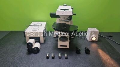 1 x Zeiss Axiophot Microscope with 2 x 10 x Eyepieces and 4 x Optics Including 1 x 20x, 1 x 10x, 1 x 2.5x and 1 x 5x (Powers Up, Some Casing Damage)