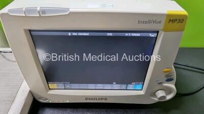 1 x IntelliVue MP30 Patient Monitor with Printer Option (Powers Up) 1 x Hewlett Packard PageWriter 100 ECG Machine on Stand with 10 Lead ECG Leads (Powers Up) and 1 x Marsden Weighing Scales (Powers Up) * SN DE728B2638 / CNC4223516* - 2