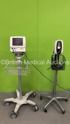 1 x Welch Allyn Vital Signs Monitor on Stand with Power Supply (Powers Up) and 1 x Fukuda Denshi Dynascope DS-7100 Monitor on Stand (Powers Up with Faulty Touch Screen)