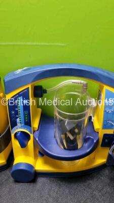 4 x Laerdal LSU Suction Units with 4 x Cups All with Missing Lids (All Power Up, 1 x Slight Damage to Casing - See Photo) *SN 78331076569 / 78020437668 / 78331076565 / 78390851992* - 3