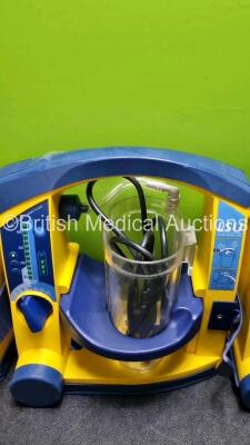 "4 x Laerdal LSU Suction Units with 4 x Cups All with Missing Lids (All Power Up 2 x with Damage to Casing - See Photo ) *SN 78170896057 / 785109684426 / 78020437842 / 78510968427*" - 4