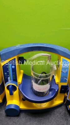 4 x Laerdal LSU Suction Units with 4 x Cups All with Missing Lids (All Power Up 2 x with Damage to Casing - See Photo ) *SN 78170896057 / 785109684426 / 78020437842 / 78510968427* - 5