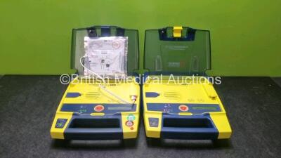 2 x Cardiac Science Powerheart AED G3 Defibrillators with 2 x Powerheart AED G3 Batteries and 1 x Out of Date Electrode Pack (Both Power Up)