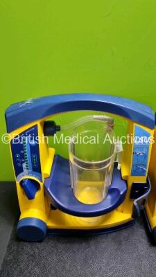 4 x Laerdal LSU Suction Units with 4 x Cups All with Missing Lids (All Power Up 1 x with Slight Damage to Casing - See Photo) *SN 78331076567 / 78021969004 / 7816107920 / 78161071916* - 5