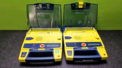 2 x Cardiac Science Powerheart AED G3 Defibrillators with 2 x Powerheart AED G3 Batteries (Both Power Up)