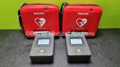 2 x Philips FR3 Heartstart Defibrillators in Carry Cases with 2 x Batteries *Install Before 03-2024 / 04-2024*(Both Power Up and Pass Self Test) *SN C18G-00733 / C18G-00106