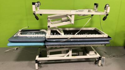 2 x Huntleigh Electric Patient Examination Couches (Both Power Up, 1 with Damaged Controller Cable and 1 with Damaged Cushion-See Photos) *SN NA*