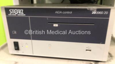 Karl Storz Stack Trolley Including 1 x Karl Storz Endoskope AIDA II 200460 20 control Unit, 1 x Karl Storz Endoskope AIDA 200960 20 control Unit, 2 x Karl Storz Endoskope 264305 20 SCB electronic endoflator Units and 1 x Karl Storz Endoskope SCB unidrive - 4