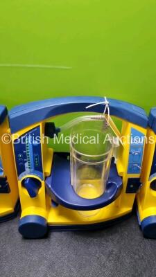 4 x Laerdal LSU Suction Units with 4 x Cups All with Missing Lids (All Power Up 1 x with Damage to Casing - See Photo) *SN 78020437670 / 78331076560 / 76331076555 / 78331076579* - 3