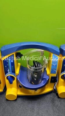 4 x Laerdal LSU Suction Units with 4 x Cups All with Missing Lids (All Power Up 2 with Damage to Casing - See Photo) *SN 78161071930 / 78161071912 / 78200441933 / 78161071921* - 4