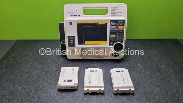 Medtronic Lifepak 12 Biphasic Defibrillator / Monitor Including Pacer, ECG and Printer Options with 3 x Batteries Ref 11141-000106 (Powers Up with Stock Battery, Stock Battery Not Included, Missing Printer - See Photos)