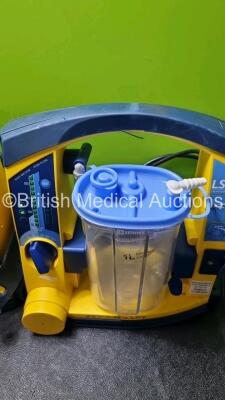 4 x Laerdal LSU Suction Units with 4 x Cups and lids (All Power Up, 3 x with Damage to Casing - See Photos) - 2