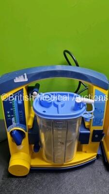 4 x Laerdal LSU Suction Units with 4 x Cups and lids (All Power Up, 3 x with Damage to Casing - See Photos) - 5