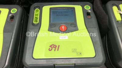 3 x Zoll AED PRO Defibrillators with 2 x Batteries, 3 x 3 Lead ECG Leads, 4 x Electrode Packs *2 x in Date, 2 x Out of Date* in Carry Cases (All Power Up) *SN AA06H003379 / AA09C013177 / AA13B027589* - 4