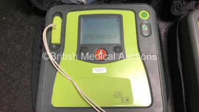 3 x Zoll AED PRO Defibrillators with 3 x Batteries, 2 x 3 Lead ECG Leads, 3 x Electrode Packs *2 x in Date, 1 x Out of Date* in Carry Cases (All Power Up) *SN AA13B027604 / AA13C027928 / AA13B027591* - 2