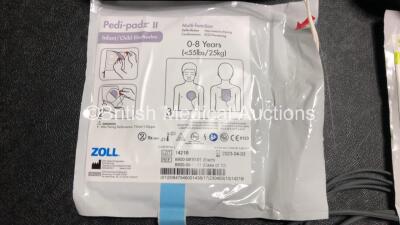 3 x Zoll AED PRO Defibrillators with 3 x Batteries, 2 x 3 Lead ECG Leads, 3 x Electrode Packs *2 x in Date, 1 x Out of Date* in Carry Cases (All Power Up) *SN AA13B027604 / AA13C027928 / AA13B027591* - 6