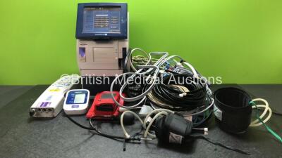 Mixed Lot Including 1 x Radiometer ABL 90 Flex Gas Analyzer (Powers Up) 1 x Invacare CBJH16555100004 Hoist Attachment, 1 x Omron M2 Basic BP Meter (Untested Due to Missing Batteries) 1 x Hemocue Hb 201 DM Blood Glucose Meter (Powers Up) Various Patient Mo