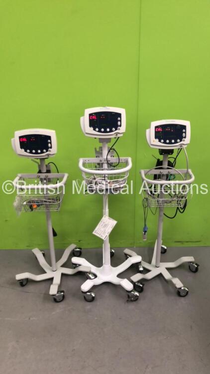 3 x Welch Allyn 53N00 Patient Monitors on Stands with 3 x AC Power Supplies and 3 x SpO2 Leads/Sensors (All Power Up)