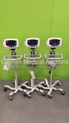 3 x Welch Allyn 53N00 Patient Monitors on Stands with 3 x AC Power Supplies and 2 x SpO2 Leads/Sensors (All Power Up)