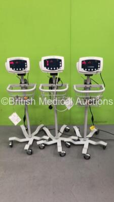 3 x Welch Allyn 53N00 Patient Monitors on Stands with 3 x AC Power Supplies and 2 x SpO2 Leads/Sensors (All Power Up)