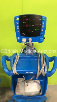 4 x Dinamap V100 Vital Signs Monitors with 4 x SPO2 Finger Sensors, 4 x BP Cuffs and Hoses and 4 x Power Supplies on Stands (All Power Up) - 2