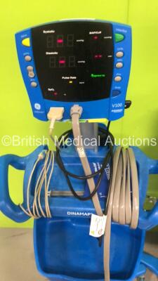 4 x Dinamap V100 Vital Signs Monitors with 4 x SPO2 Finger Sensors, 4 x BP Cuffs and Hoses and 4 x Power Supplies on Stands (All Power Up) - 5