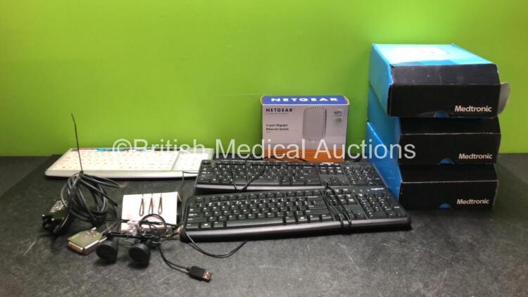 Mixed Lot Including 1 x Depuy FMS Connect Interface Cable, 1 x Heine Magnification Glasses, 1 x Netgear 5 Port Gigabit Ethernet Switch, 3 x Keyboards and 3 x Medtronics My Care Links *SN H38A30709, 081100351, 1835SY02HQ88, 1834MR11B6F8*