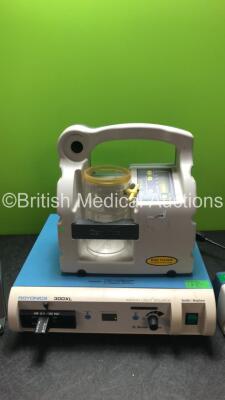 Mixed Lot Including 1 x Smith & Nephew Dyonics 300XL Xenon Light Source (Powers Up) 1 x Oxylitre PSP002 Elite High Suction Unit with Cup (Powers Up with Missing Lid-See Photo) 1 x Carefusion Alaris PK Pump (Powers Up) 1 x Medtron Accutron MR Touch Screen - 3