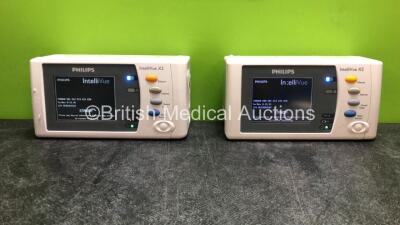 2 x Philips IntelliVue X2 Handheld Patient Monitors Including ECG, SpO2, NBP, Press and Temp Options with 2 x Philips M4607A Batteries (Both Power Up, 1 Damaged 1 with Missing Battery Cover)