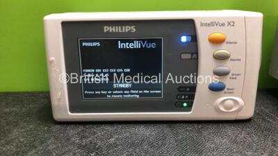 2 x Philips IntelliVue X2 Handheld Patient Monitors Including ECG, SpO2, NBP, Press and Temp Options with 2 x Philips M4607A Batteries (Both Power Up, 1 Damaged 1 with Missing Battery Cover) - 2